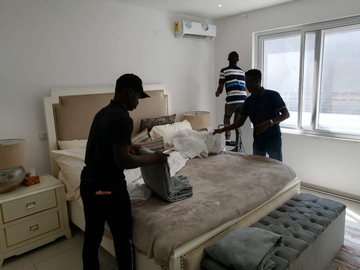 PackPro team setting up a bedroom after a residential move
